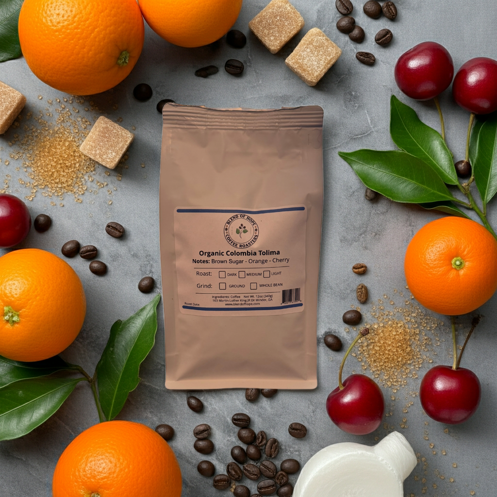 Coffee package with oranges, cherries, and coffee beans on a gray surface